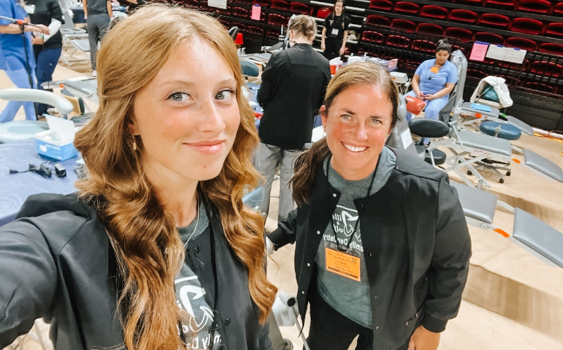 Selfie of two Altavista dental team members in a gym