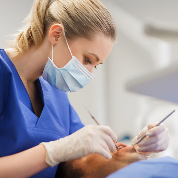 Dentist giving a patient a dental exam