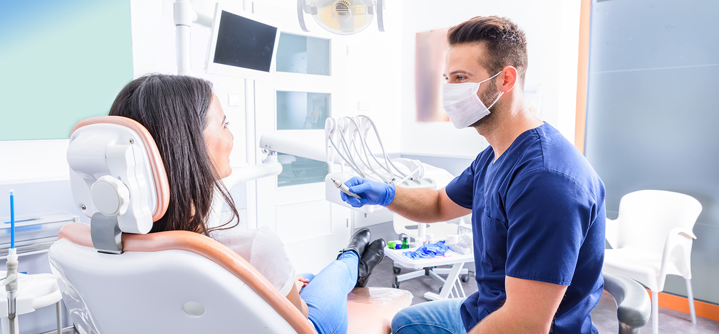 Dentist talking to a patient about dental implants in Altavista