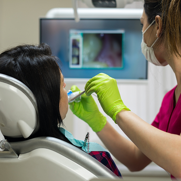 Dentist capturing close up photos of a patients teeth