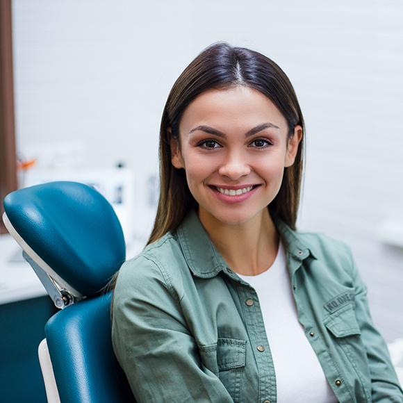 Smiling woman sitting in dental chair