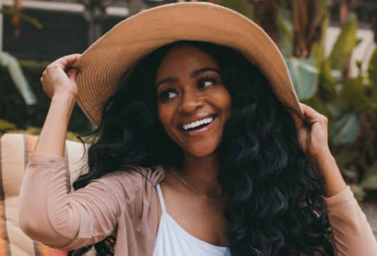 Young woman wearing a large sunhat