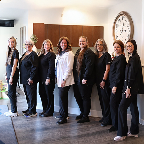 Hooks Family Dentistry team smiling in front office