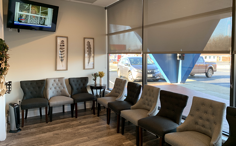 Gray chairs in waiting area of Hooks Family Dentistry