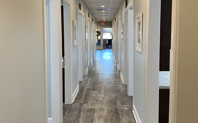 Hallway branching off into different dental treatment rooms