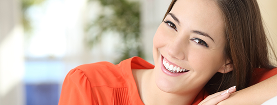 Smiling woman in orange blouse