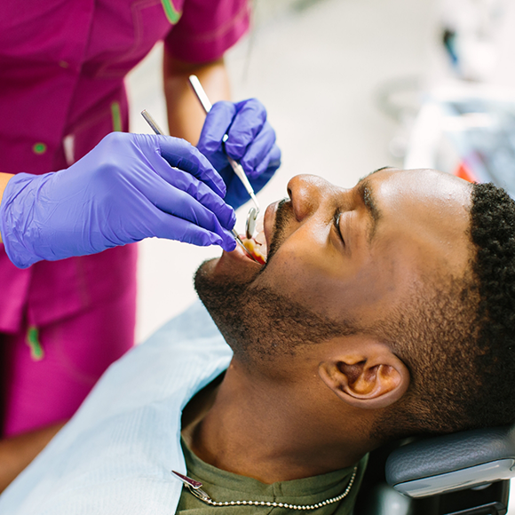 Man receiving a dental exam