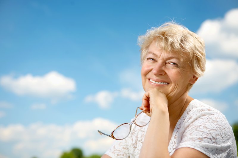 woman smiling with dentures in Altavista