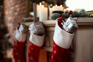 Three stocking stuffed with silver presents