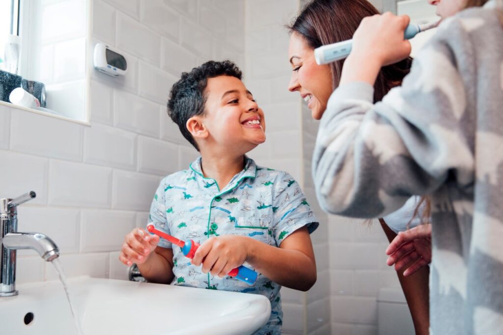 A family brushing their teeth together.